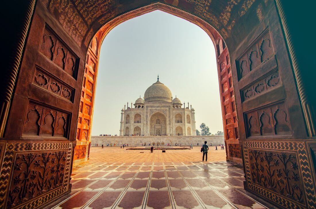 view of taj mahal A view of the taj mahal through a doorway.