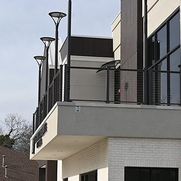 A building with a balcony and a lot of windows
