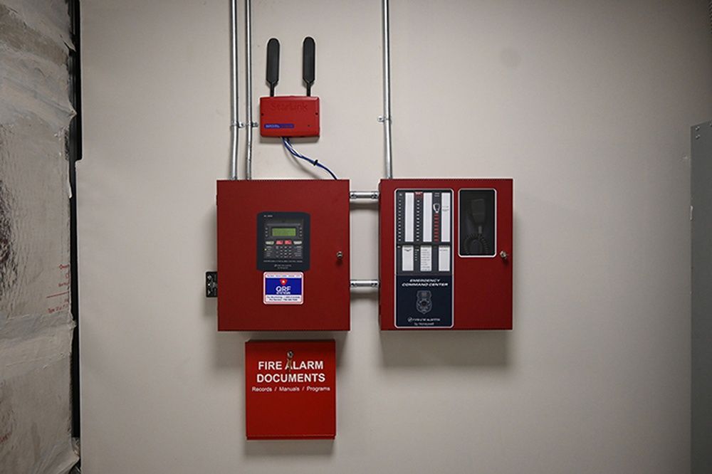 A red box on a wall that says fire alarm documents