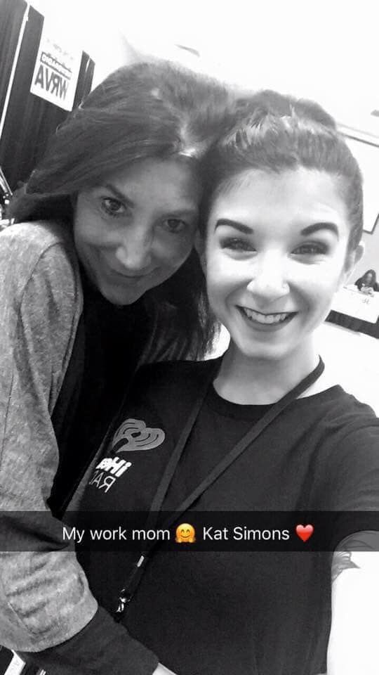 A black and white photo of two women hugging each other.