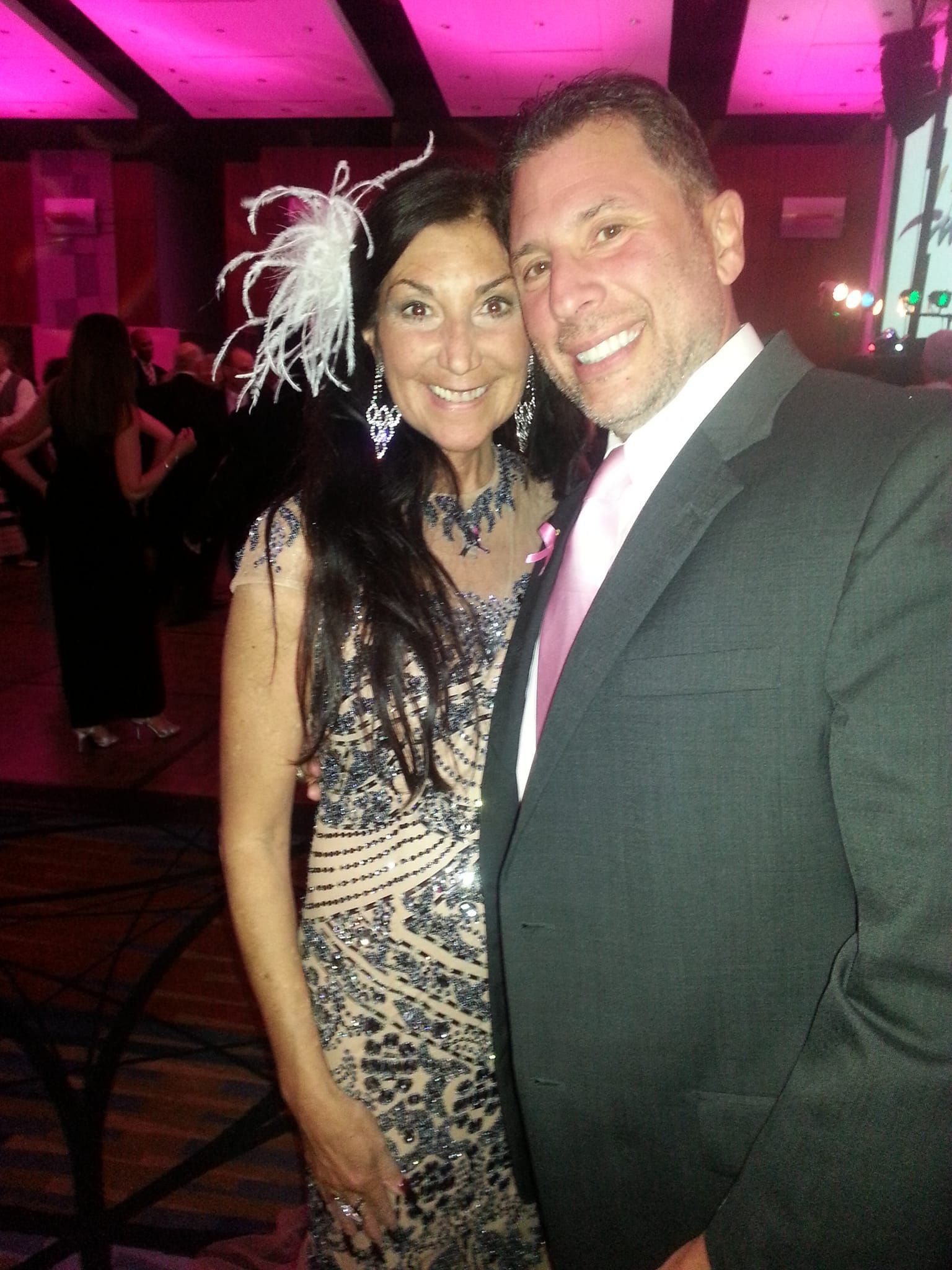 A man and a woman are posing for a picture together