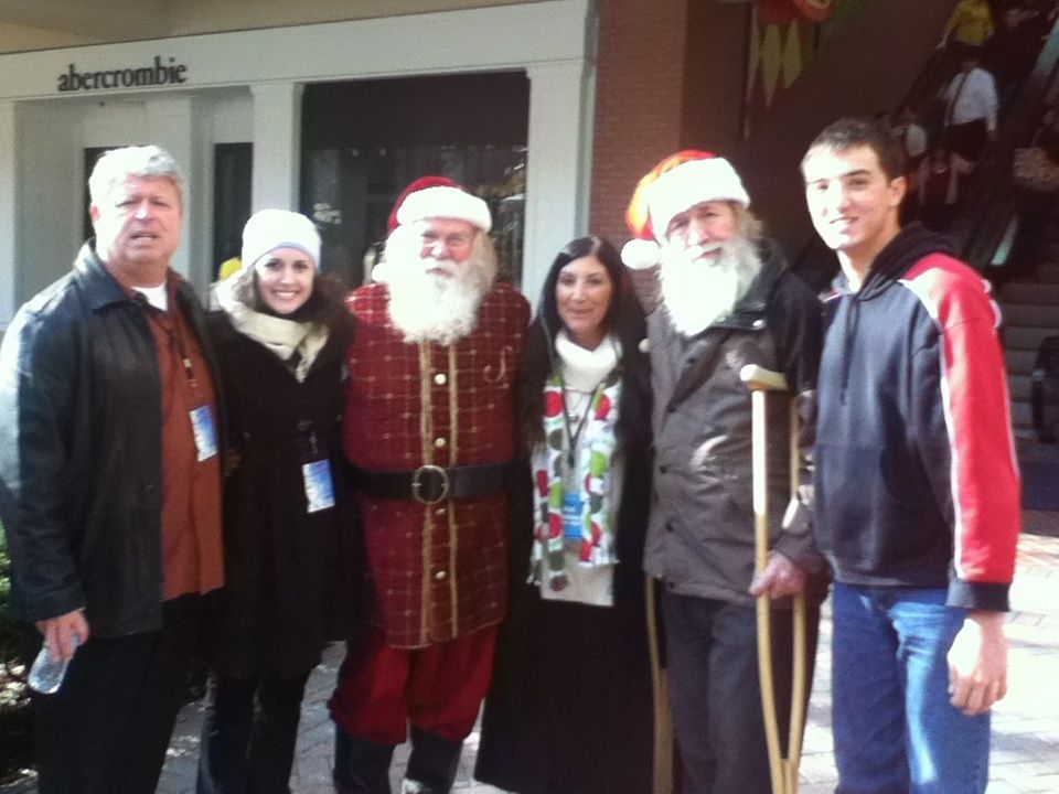 A group of people standing in front of a store called abercrombie
