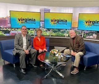 Three people are sitting on a couch in a virginia this morning studio.