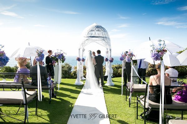 A bride and groom are walking down the aisle at a wedding