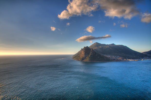 An aerial view of a small island in the middle of the ocean.
