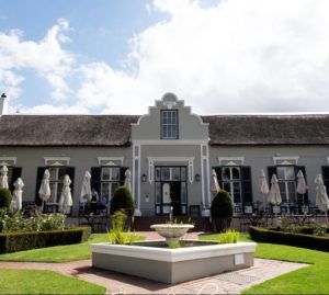 A large building with a fountain in front of it