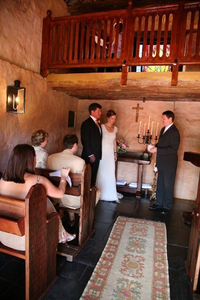 A bride and groom are getting married in a church