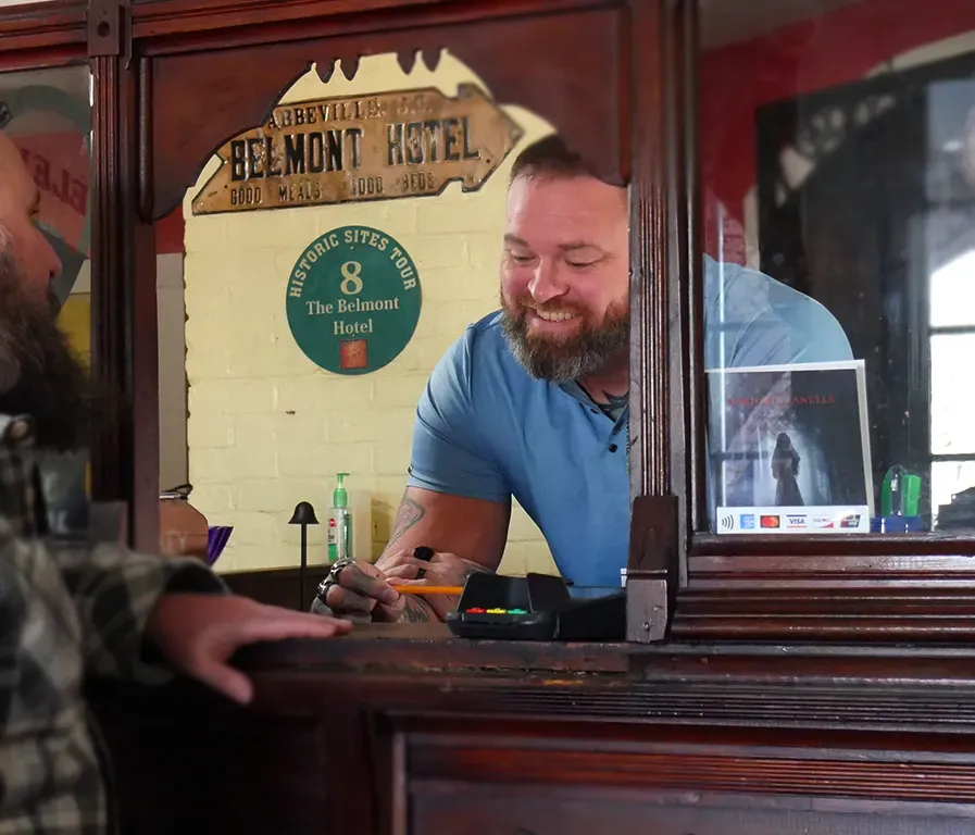 A sunset over a mountain range with a lot of fog