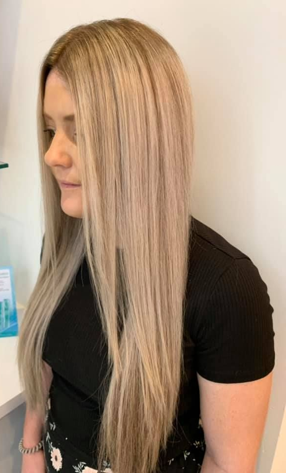 Person in Salon Chair, Back to Camera, Hair Partially Up With Blonde Ends — Artistry Of Hair in Redlynch, QLD