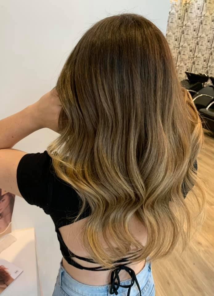 Woman With Long Brown Hair, Styled With Highlights and Waves — Artistry Of Hair in Redlynch, QLD