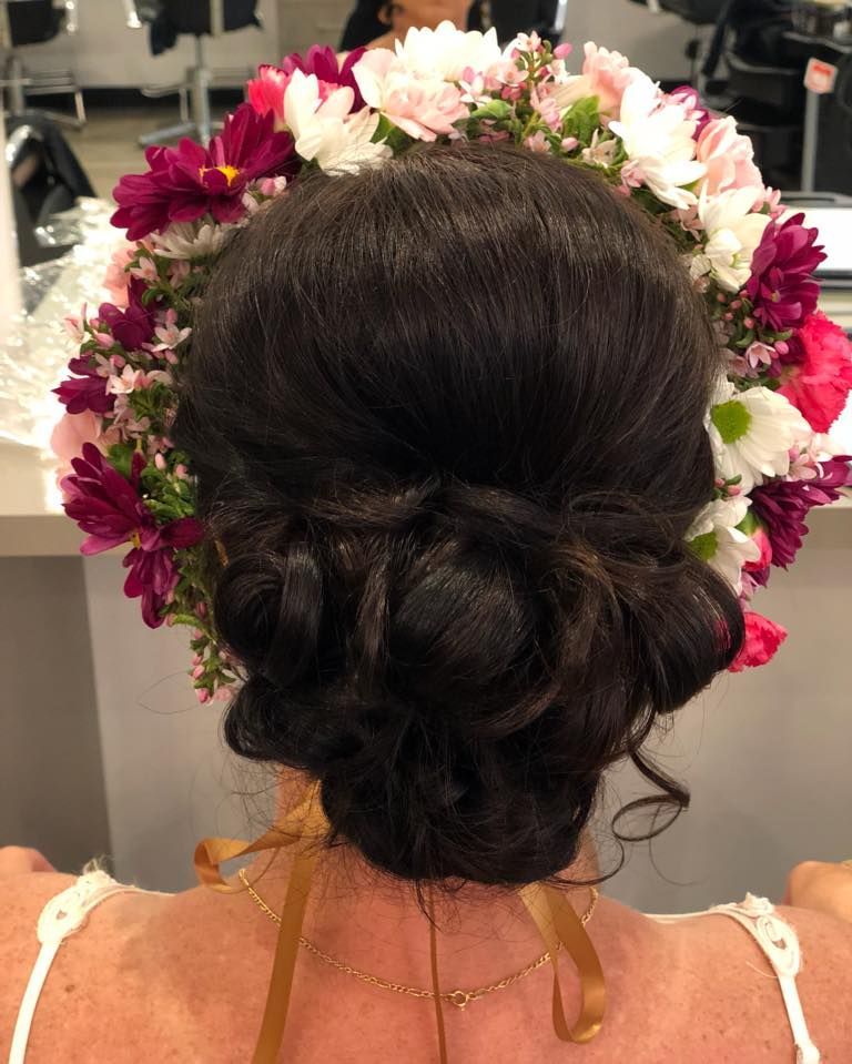 Woman With Dark Hair in an Updo, Wearing a Floral Crown — Artistry Of Hair in Redlynch, QLD