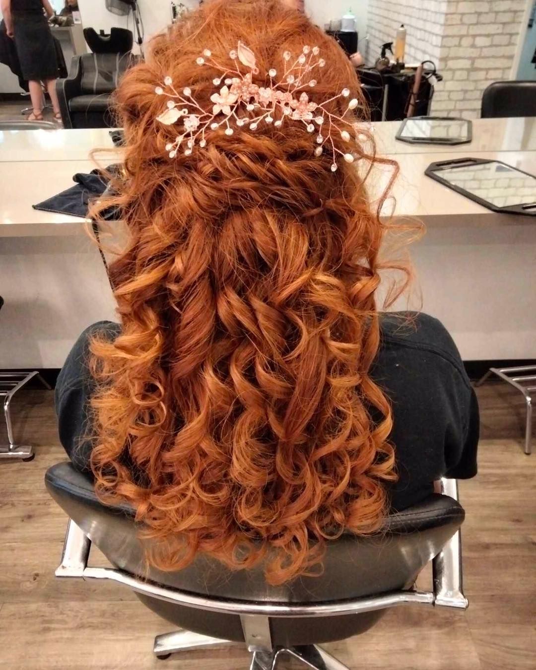 Woman With Curly, Red Hair Styled With a Rose-gold Hairpiece, Sitting in a Salon Chair — Artistry Of Hair in Kanimbla, QLD