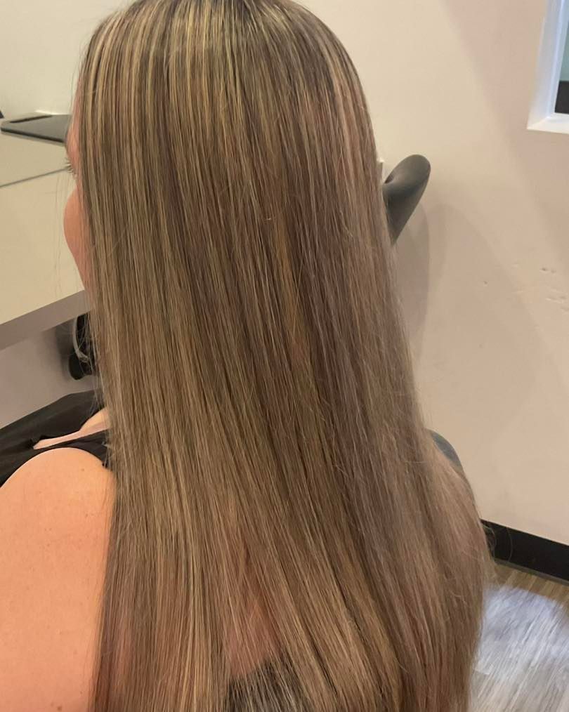 Woman With Long Hair Styled With Crimped Texture and Blonde Highlights — Artistry Of Hair in Redlynch, QLD