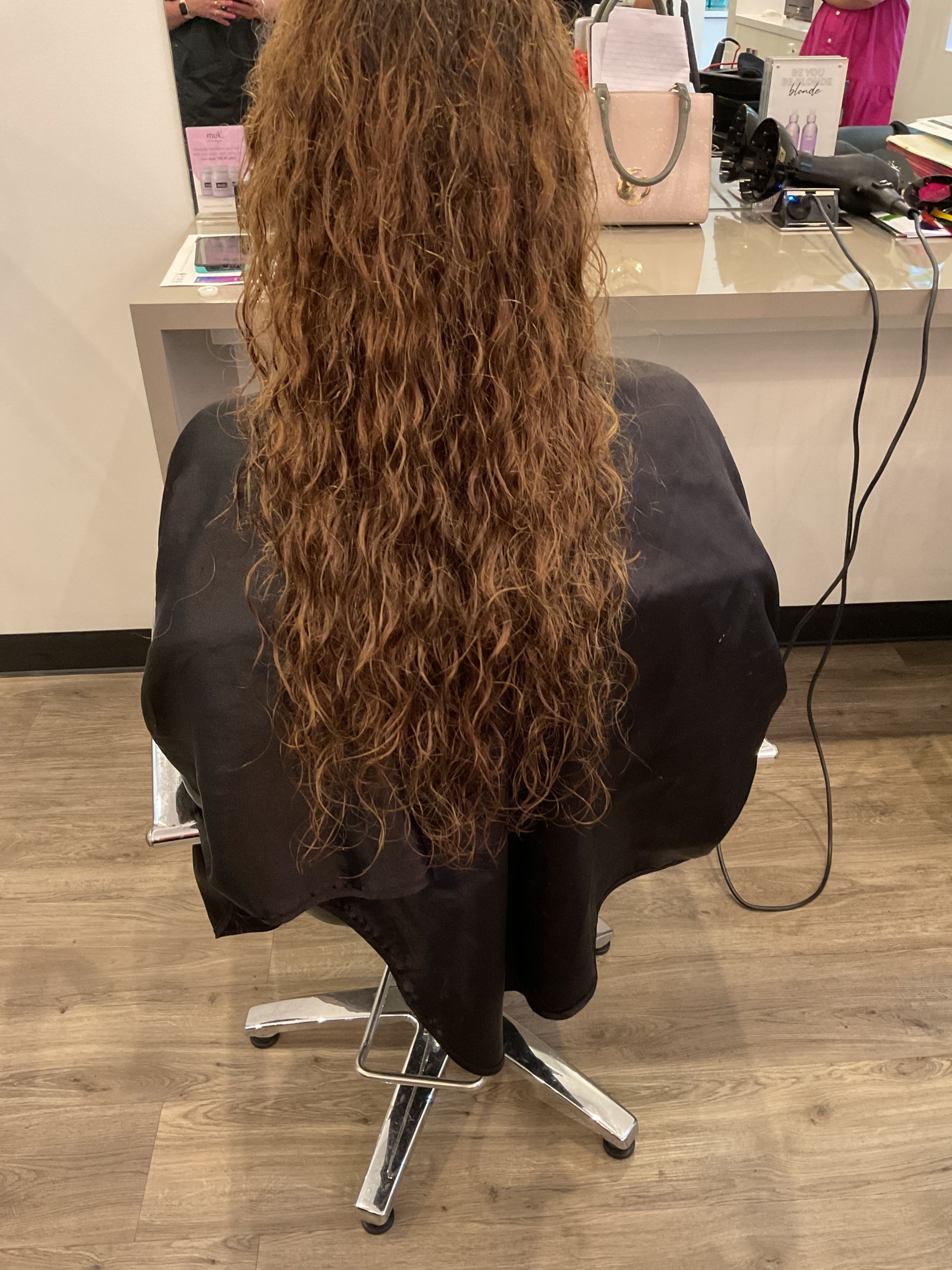 Woman With Dark Roots and Blonde Balayage, Styled With Loose Waves — Artistry Of Hair in Redlynch, QLD