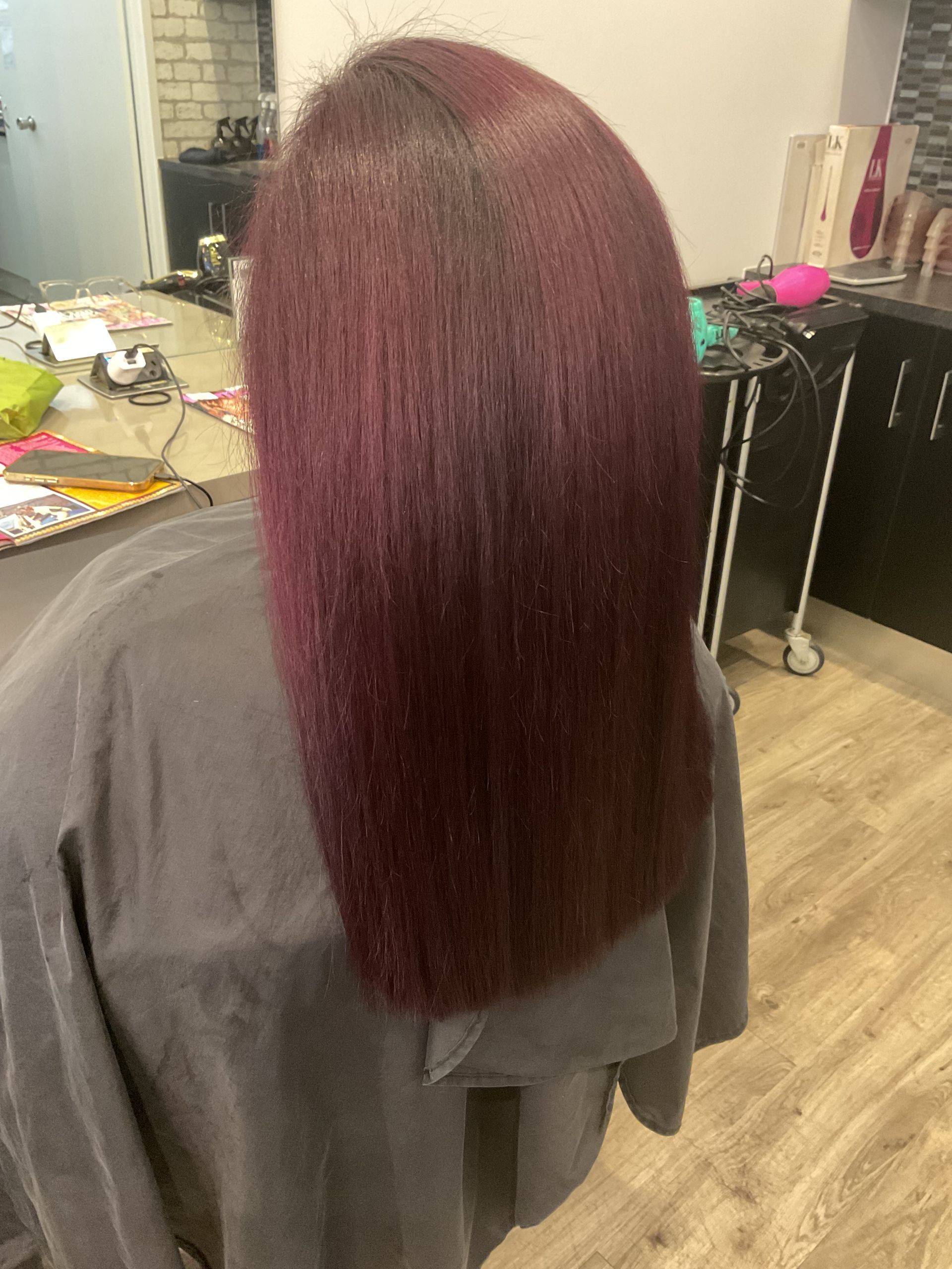 Person With Short, Bright Red Hair in a Salon Setting — Artistry Of Hair in Redlynch, QLD