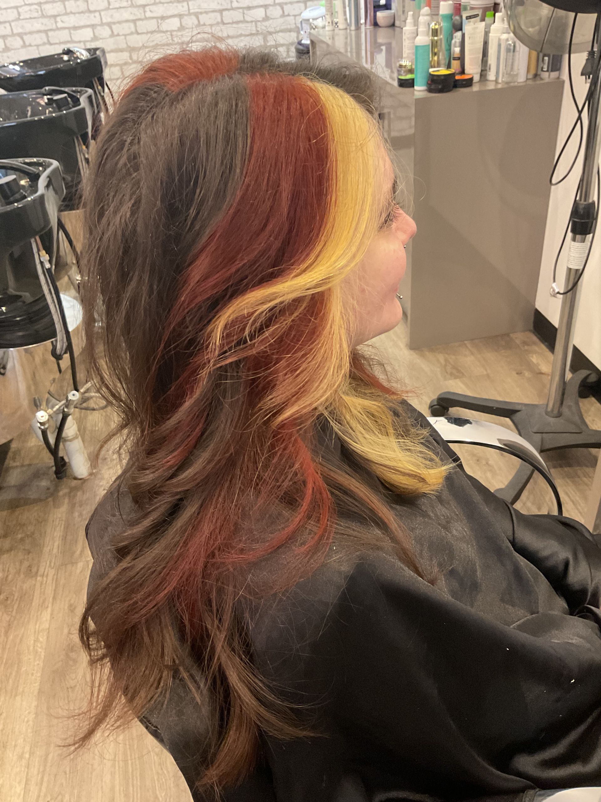 Person With Undercut Hairstyle, Vibrant Purple, Pink, and Blue Hair — Artistry Of Hair in Redlynch, QLD