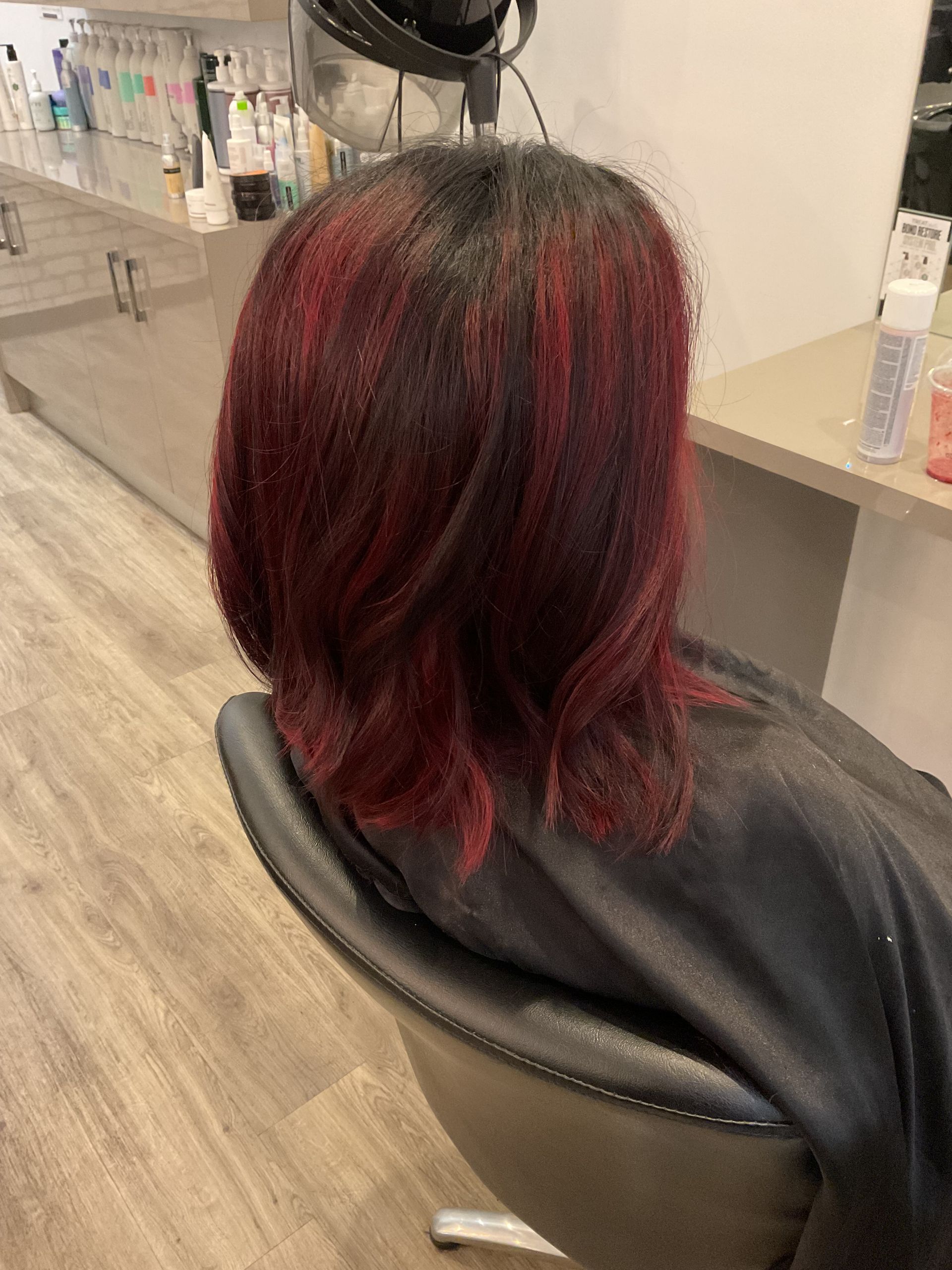 Person in Blue Gloves Applying Hair Dye With a Brush and Comb — Artistry Of Hair in Redlynch, QLD