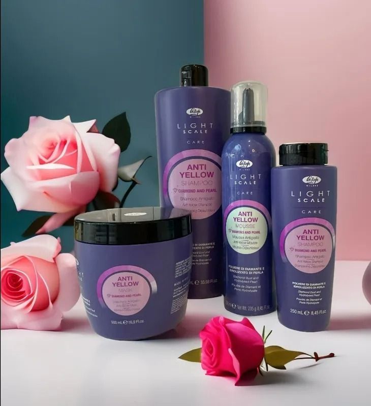 Purple Hair Care Products With Pink Roses Against a Blue and Pink Backdrop — Artistry Of Hair in Redlynch, QLD
