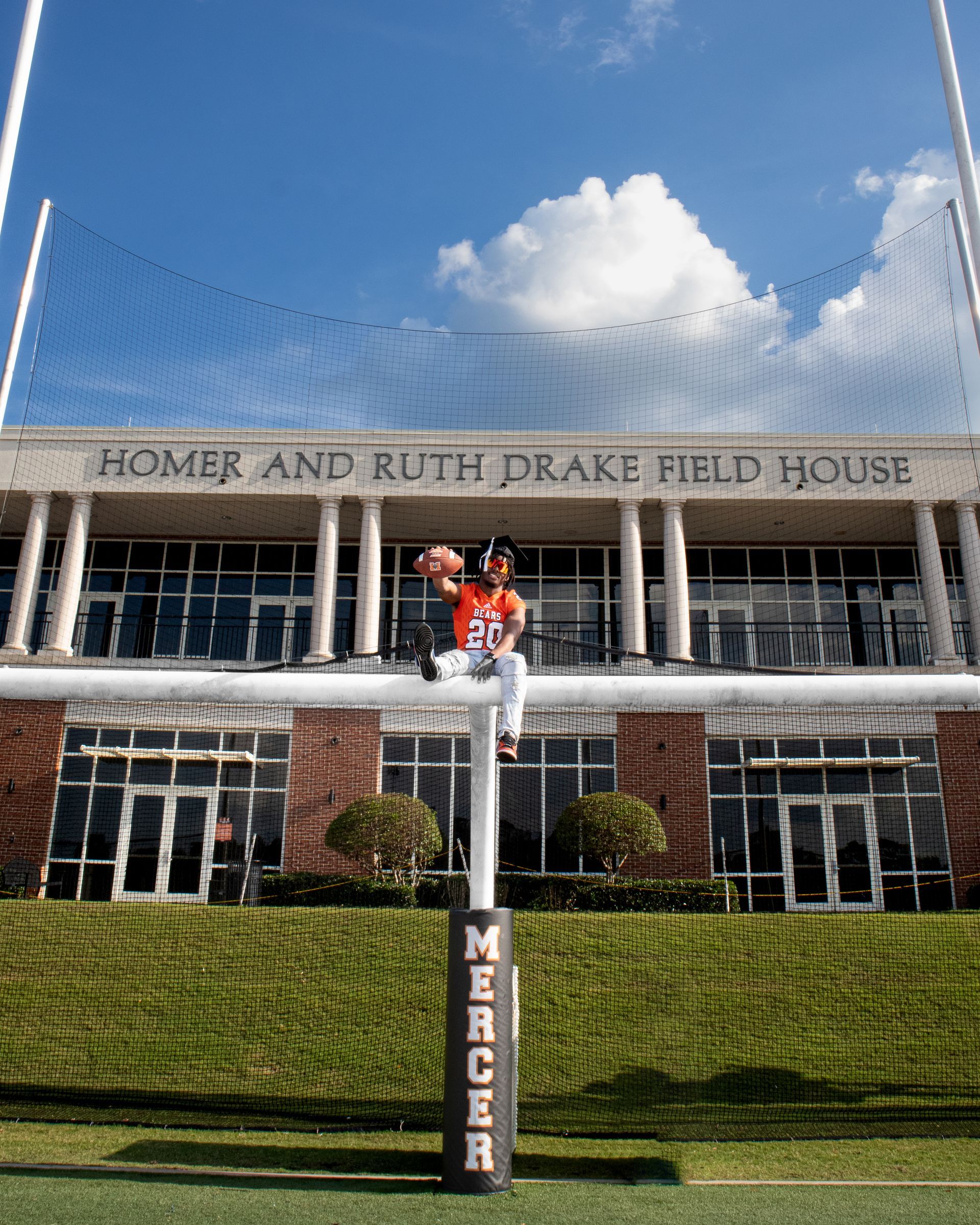 Mebane Field House at Mercer University with a red statue in front under a blue sky