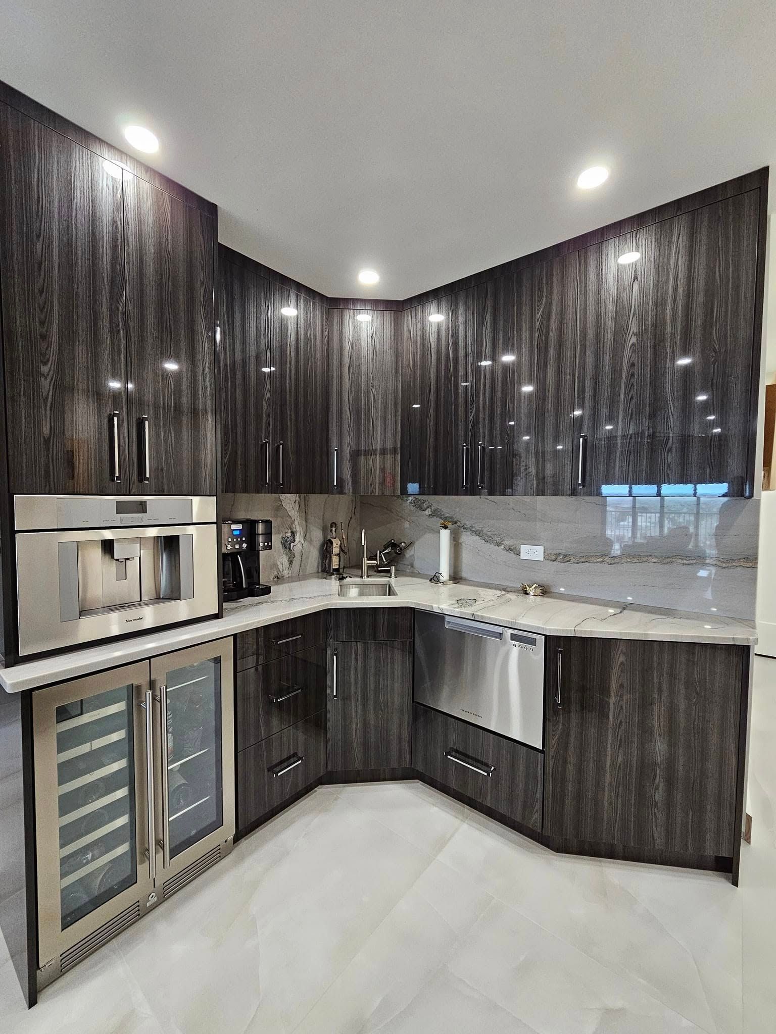 A kitchen with wooden cabinets and stainless steel appliances.