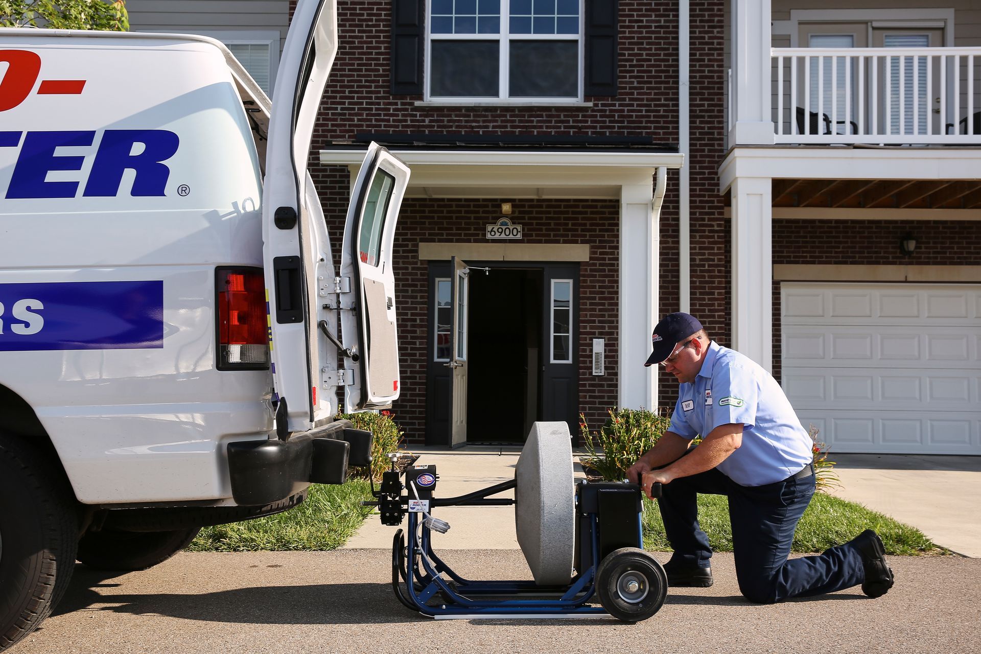 Man Preparing Tools For Cleaning Sewers - Peru, IL - Roto Rooter Sewer Service