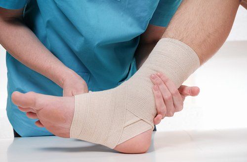 Doctor Bandaging Foot — Fresno, CA — Dr. Brent L Woodbury DPM