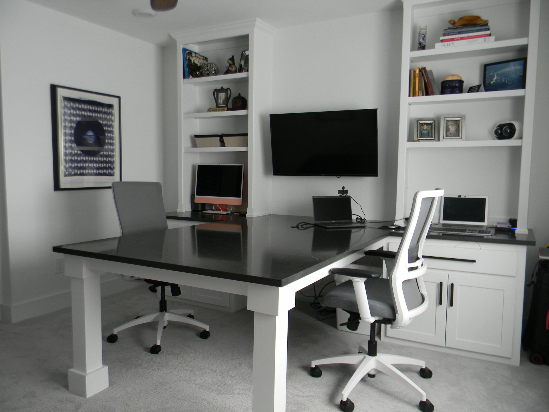 A home office with two desks and two chairs