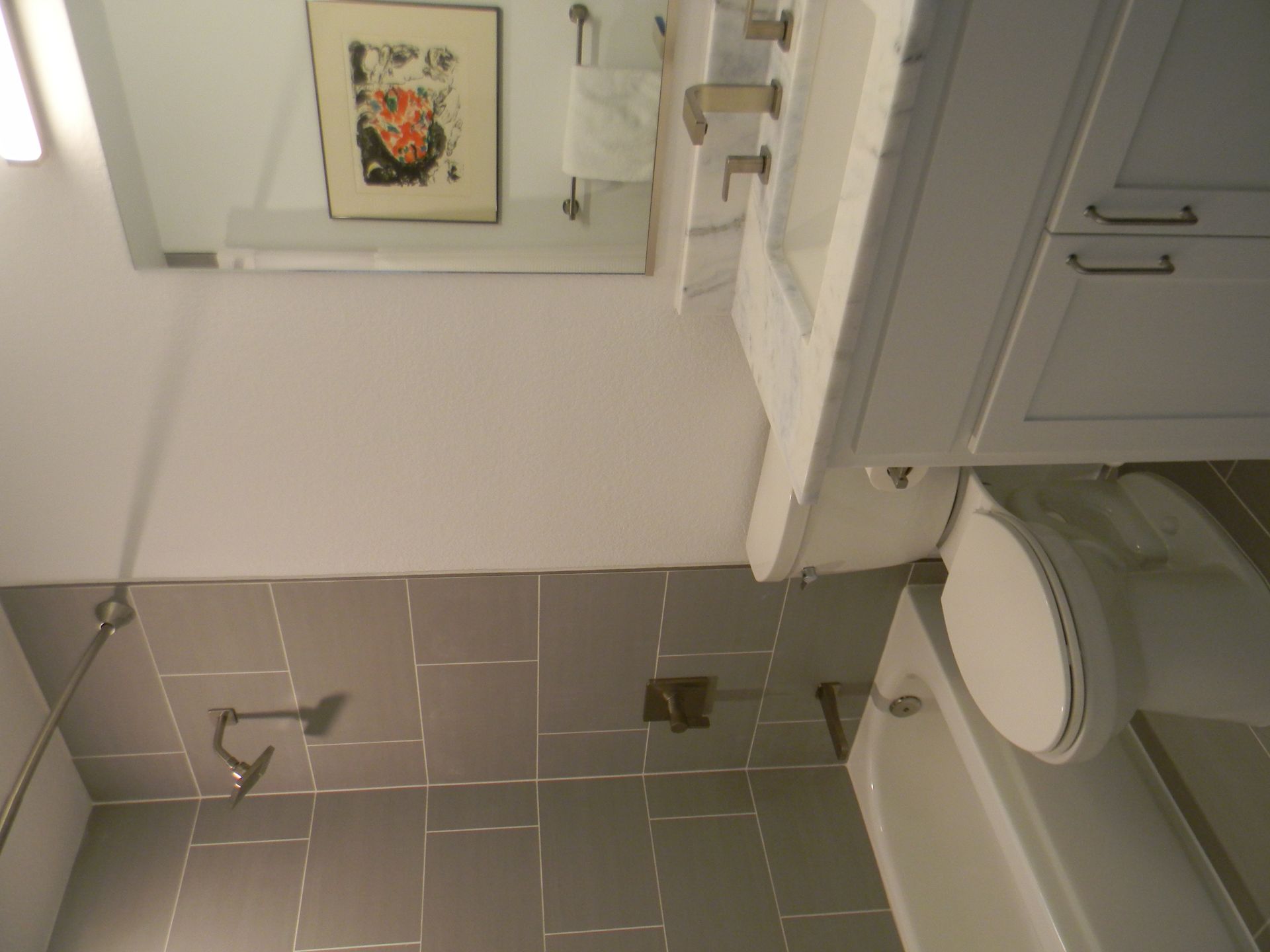 A bathroom with a toilet a sink and a bathtub