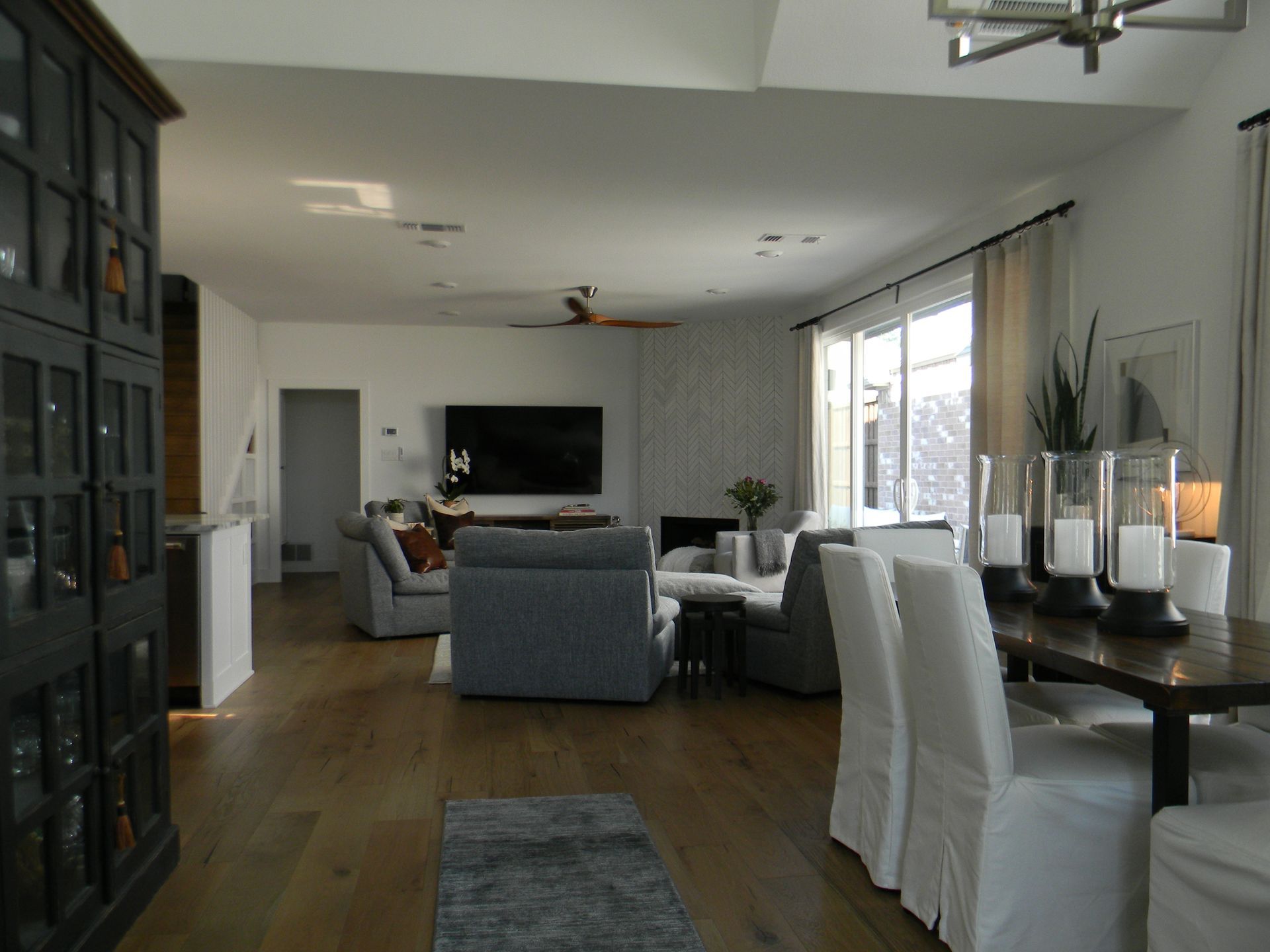 A living room with a dining table and chairs