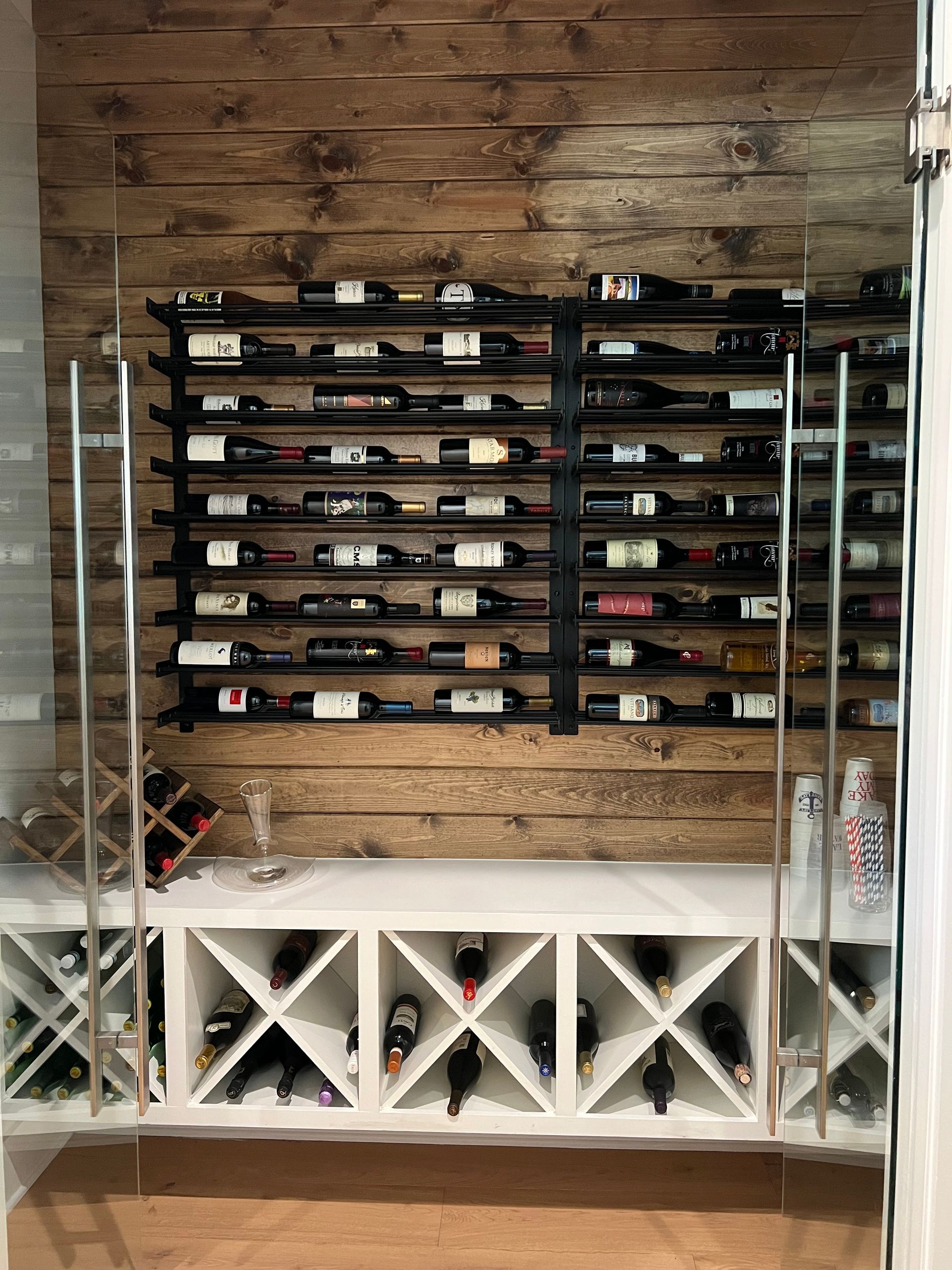 A wine cellar filled with lots of bottles of wine.
