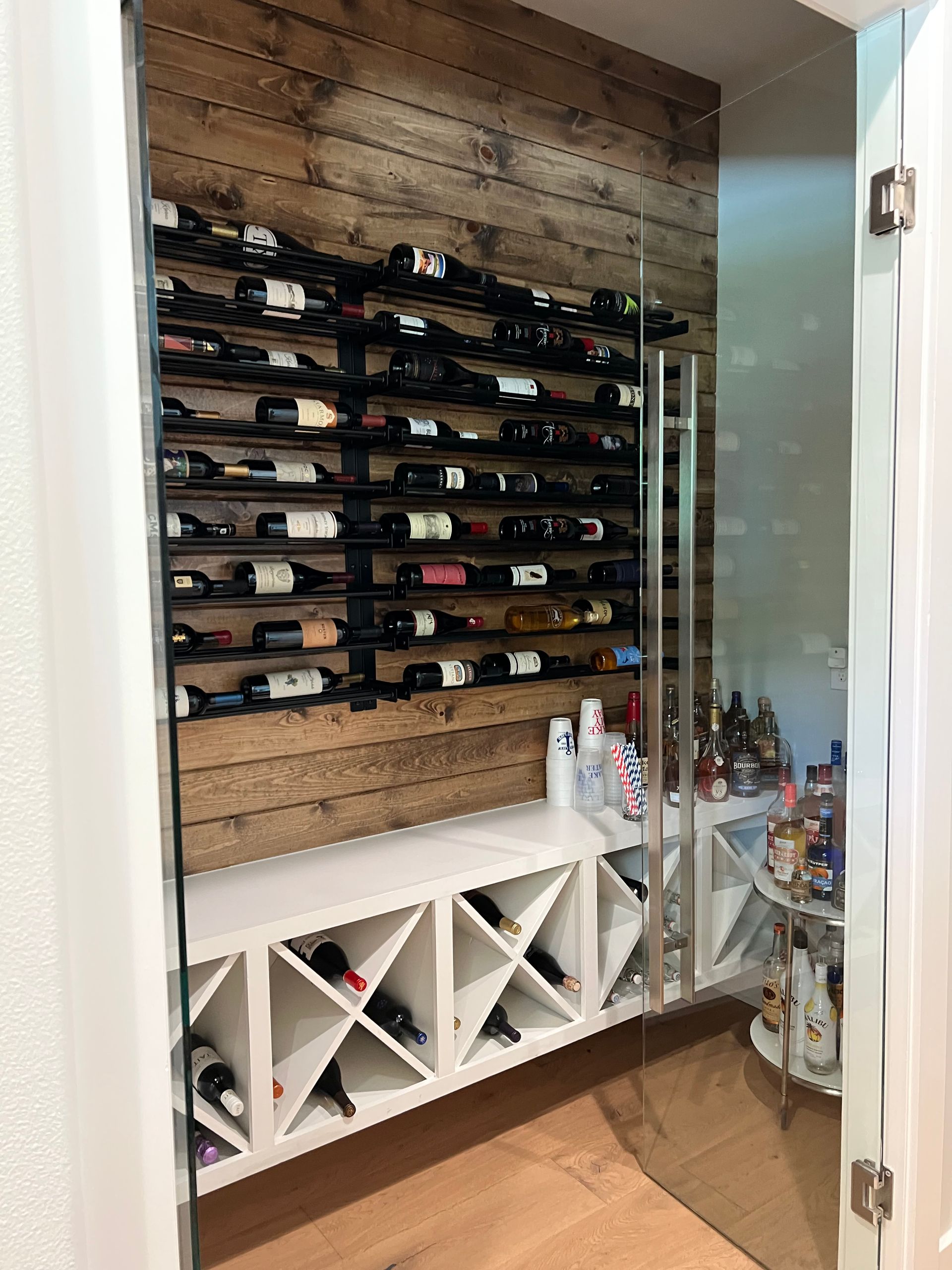 A wine cellar filled with lots of bottles of wine.