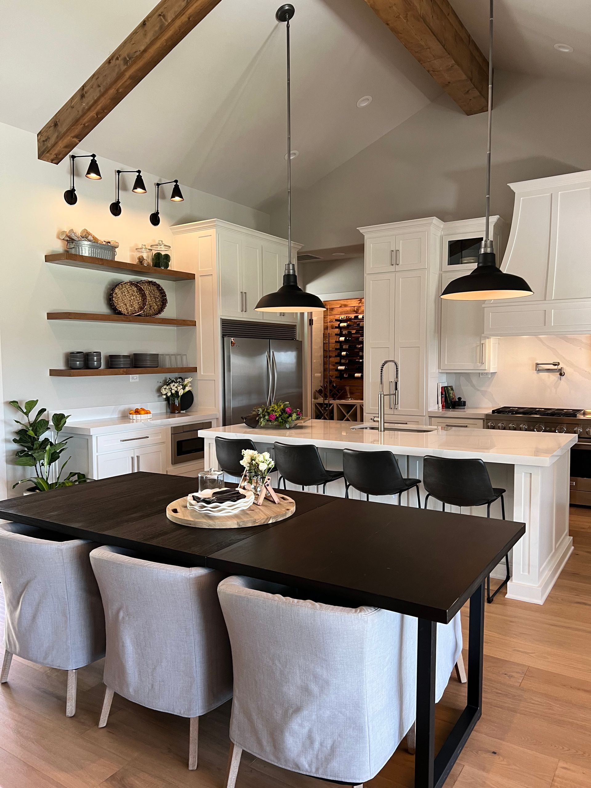 A kitchen with a table and chairs in it