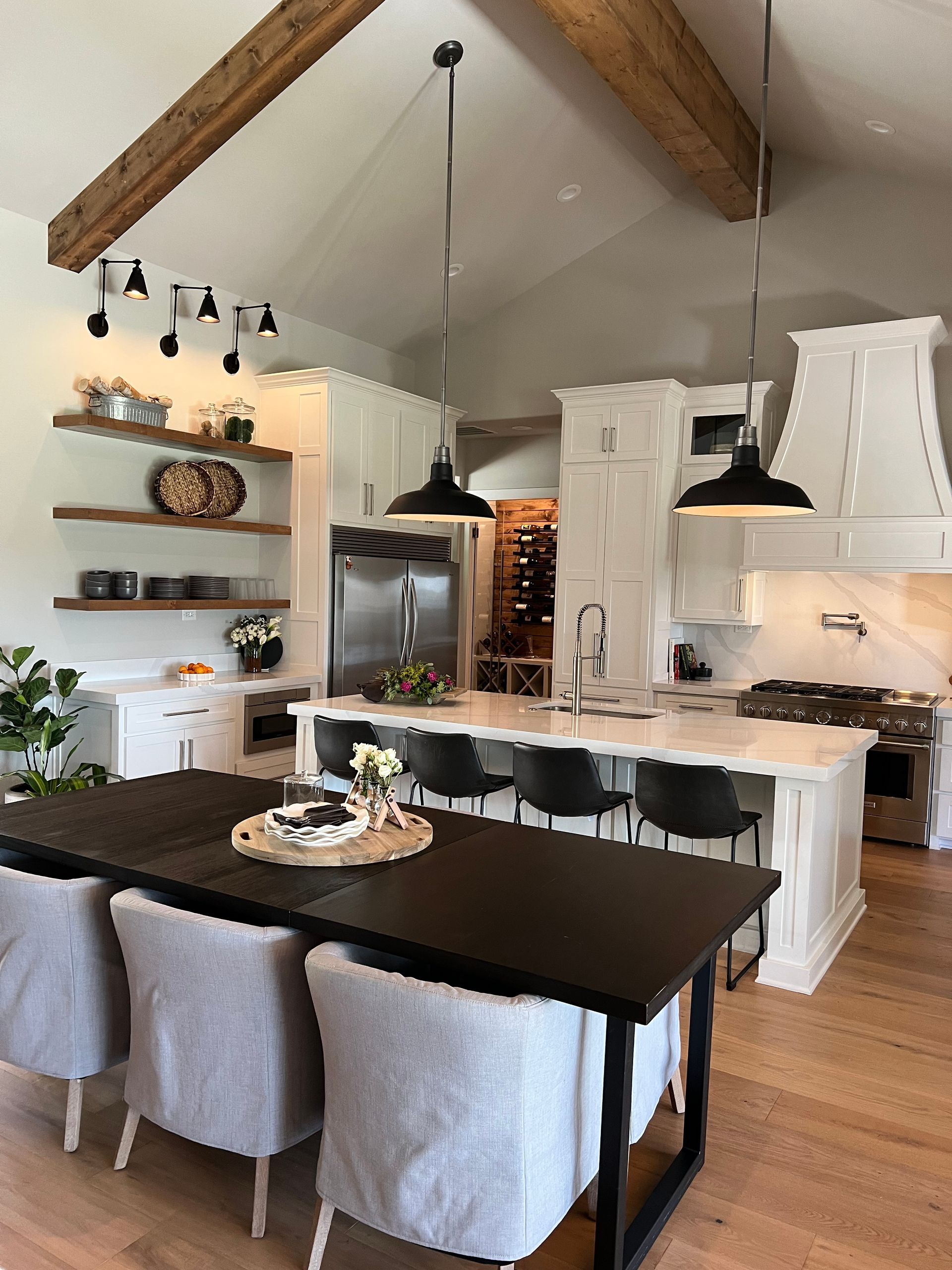 A kitchen with a table and chairs in it