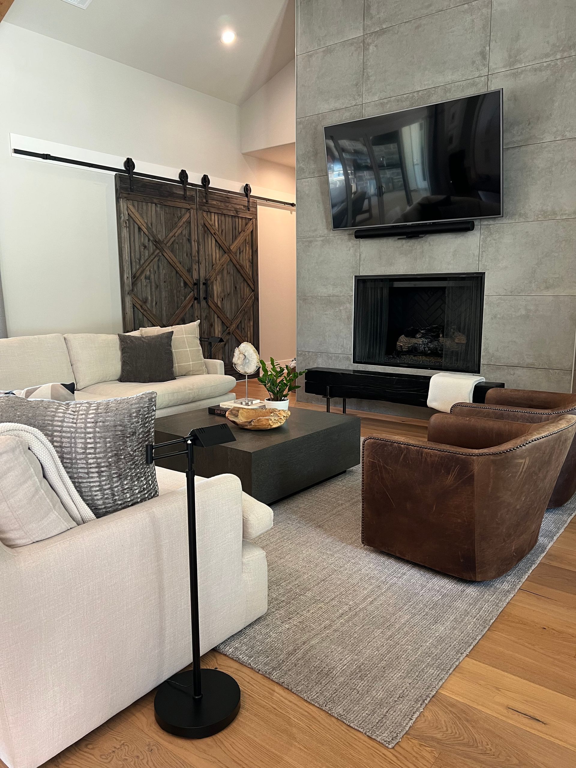 A living room filled with furniture and a fireplace.