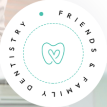 A circular logo featuring a teal tooth outline containing a heart, with 