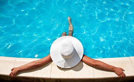 Woman in Pool — Swimming Pool Installation in Millis, MA Woman in Pool — Swimming Pool Installation in Millis, MA