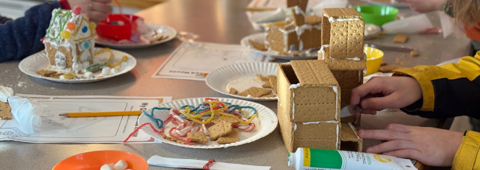 Gingerbread house stem activity - children working on their creations.
