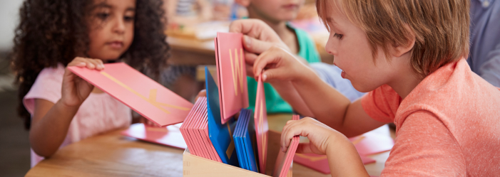 Montessori philosophy - Children working in a Montessori classroom