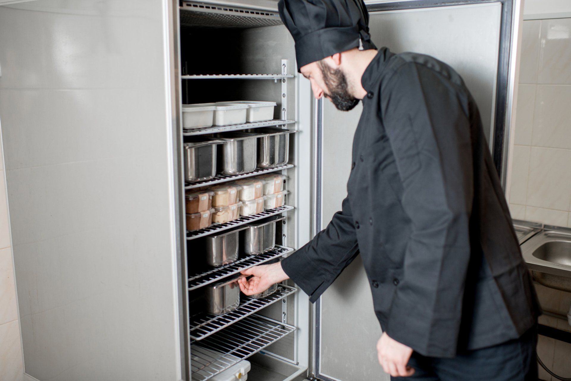 Chef Getting Foods On Freezer — Oklahoma City, OK — City Restaurant Supply