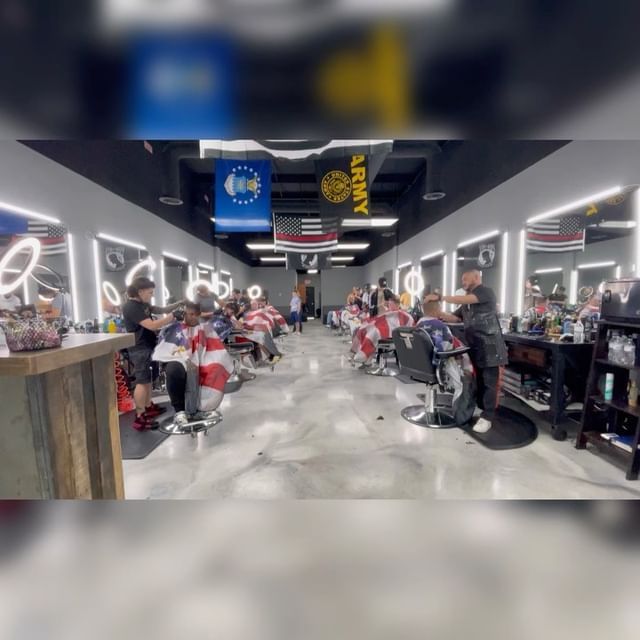 A barber shop with army flags hanging from the ceiling