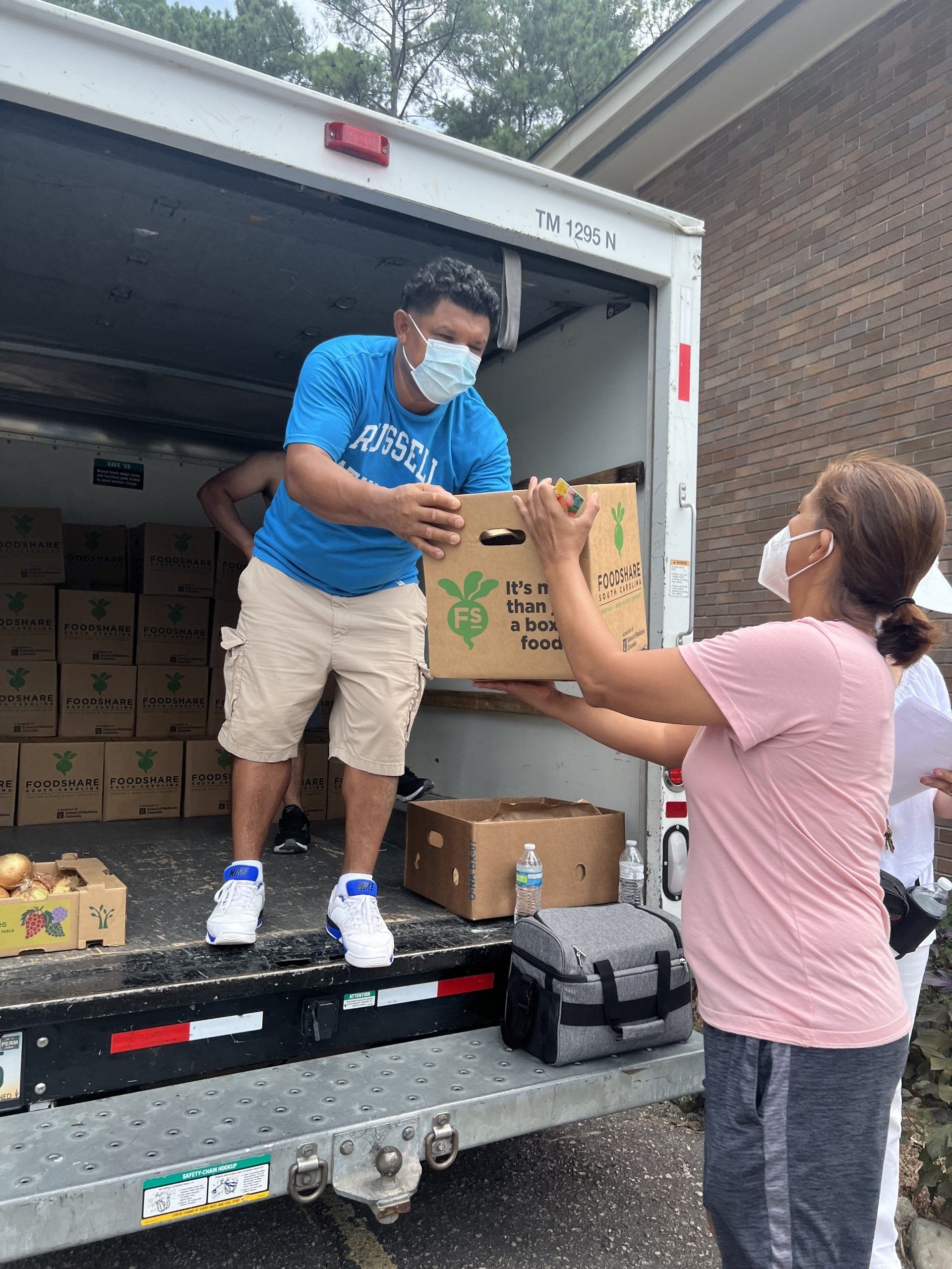 One of LCD's incredible vendors unloading food for a Food From the Heart event.