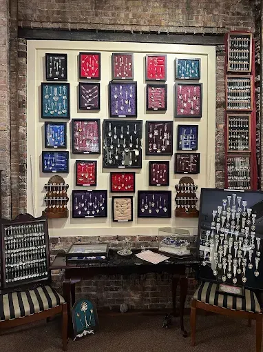 Display of vintage instruments in shadow boxes, arranged on a wall.