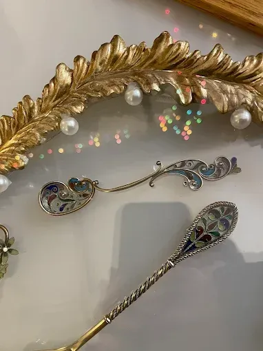 Close-up of ornate silver spoons.
