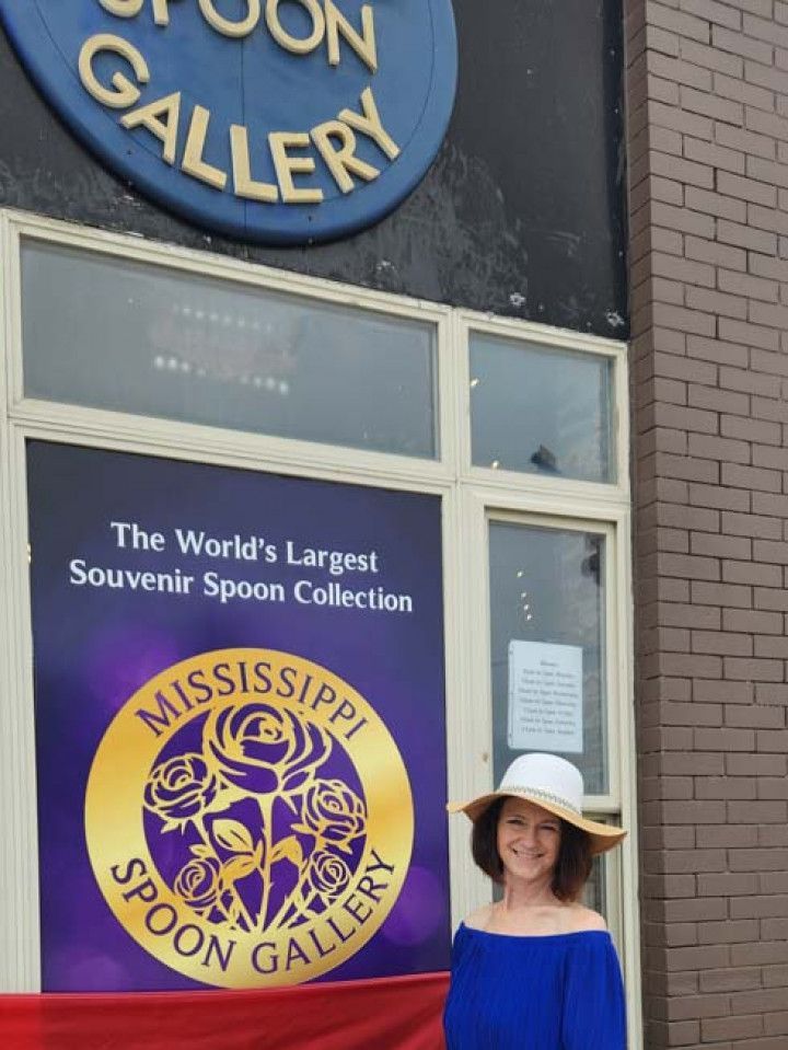 Woman in front of Mississippi Spoon Gallery.