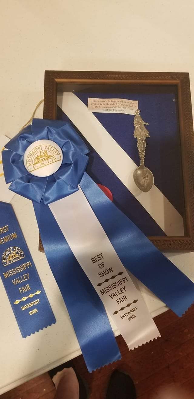 Blue and white ribbons with text.