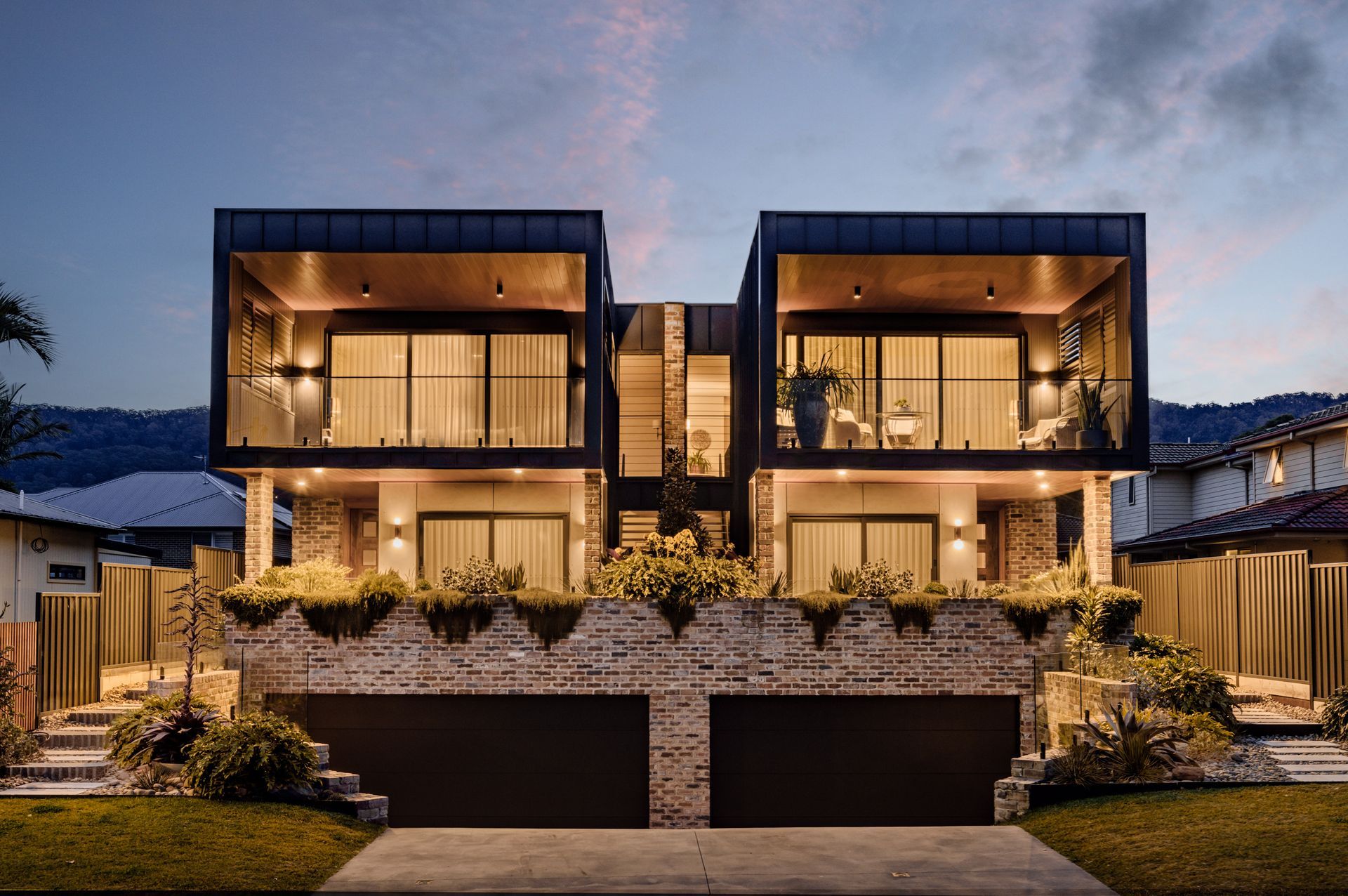 An aerial view of a large building with a fence around it.