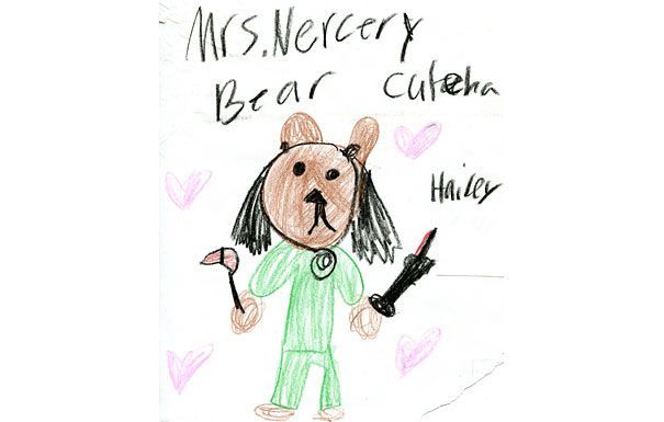 Child's drawing of a bear with black hair wearing pajamas. 