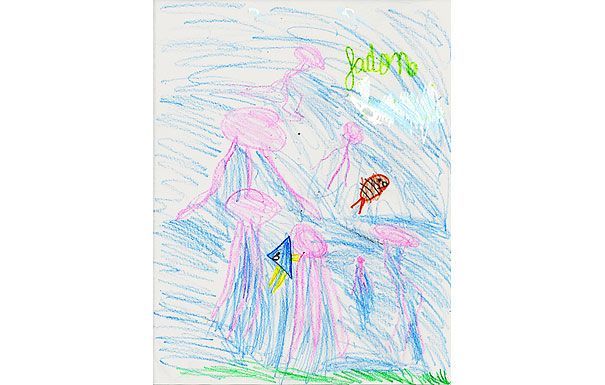 Child's crayon drawing with pink and blue shapes resembling jellyfish, a brown object, and green writing that says 
