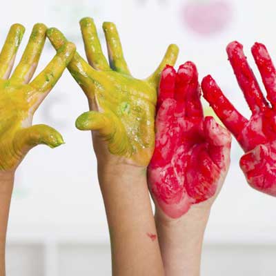 Child's hands with painting colors