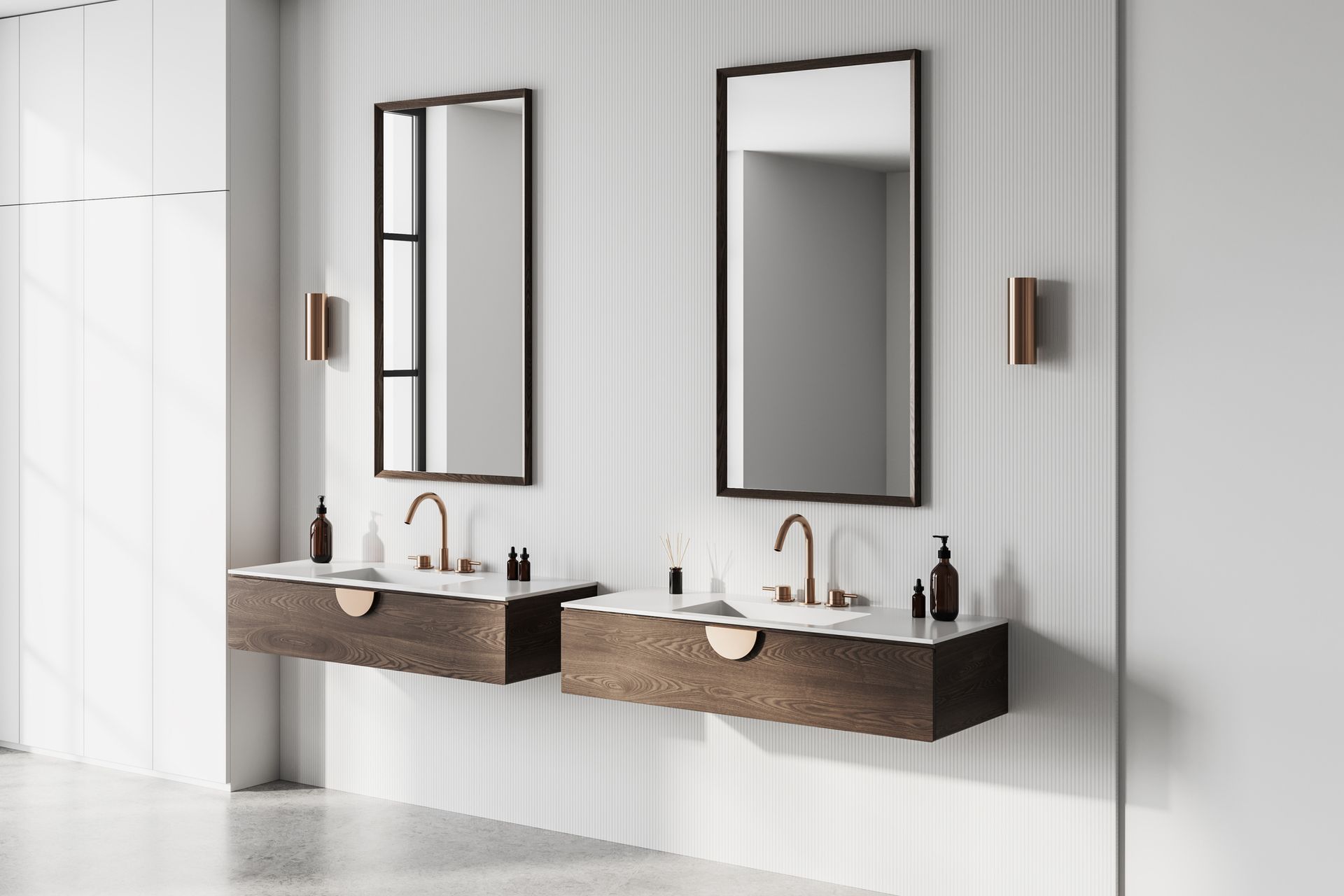 A bathroom with two sinks and two mirrors on the wall.